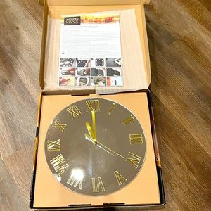 Wall mounted, battery operated clock.